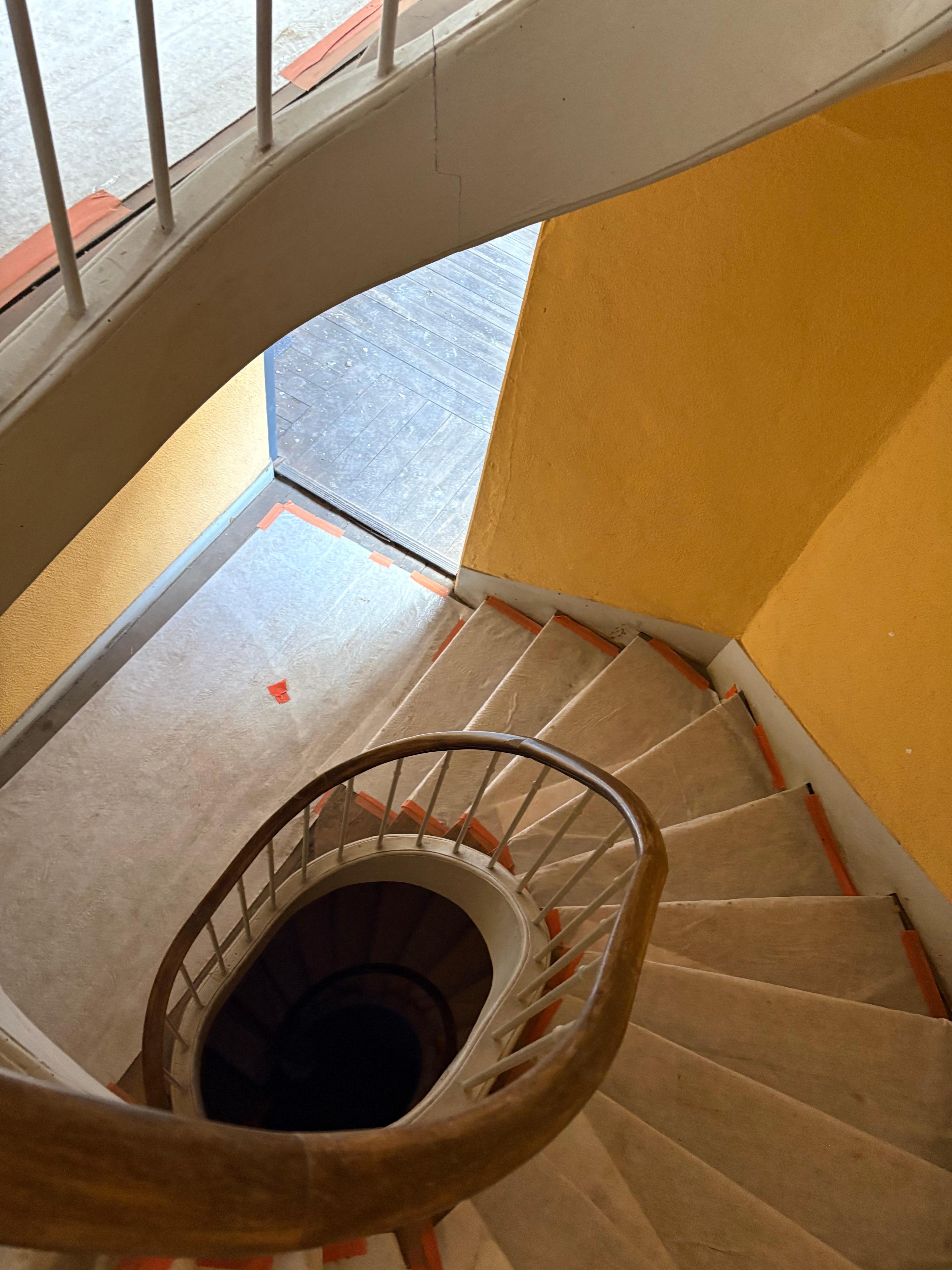 Showing the dark stairs and the steep staircase.
