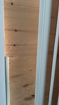 Plywood covering up what I’m assuming is a broken window.