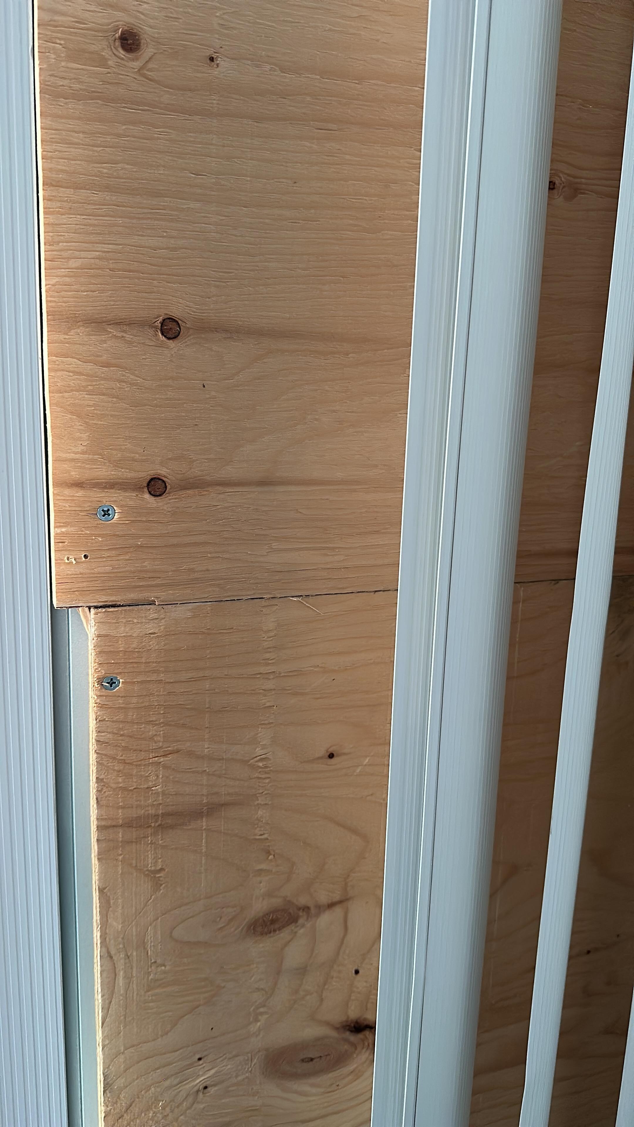 Plywood covering up what I’m assuming is a broken window. 