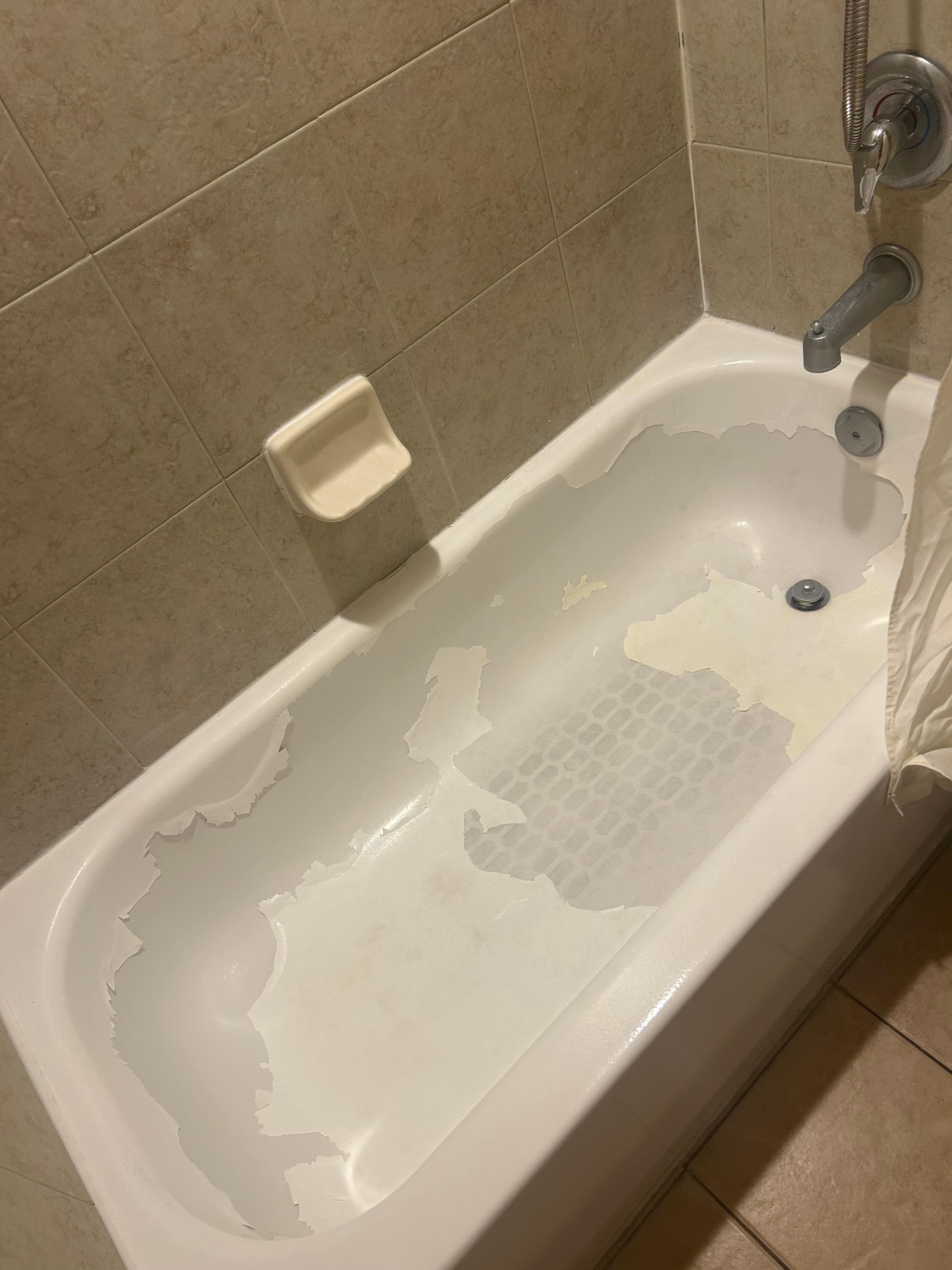 This master bath tub had been painted & now peeling!