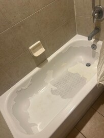 This master bath tub had been painted & now peeling!