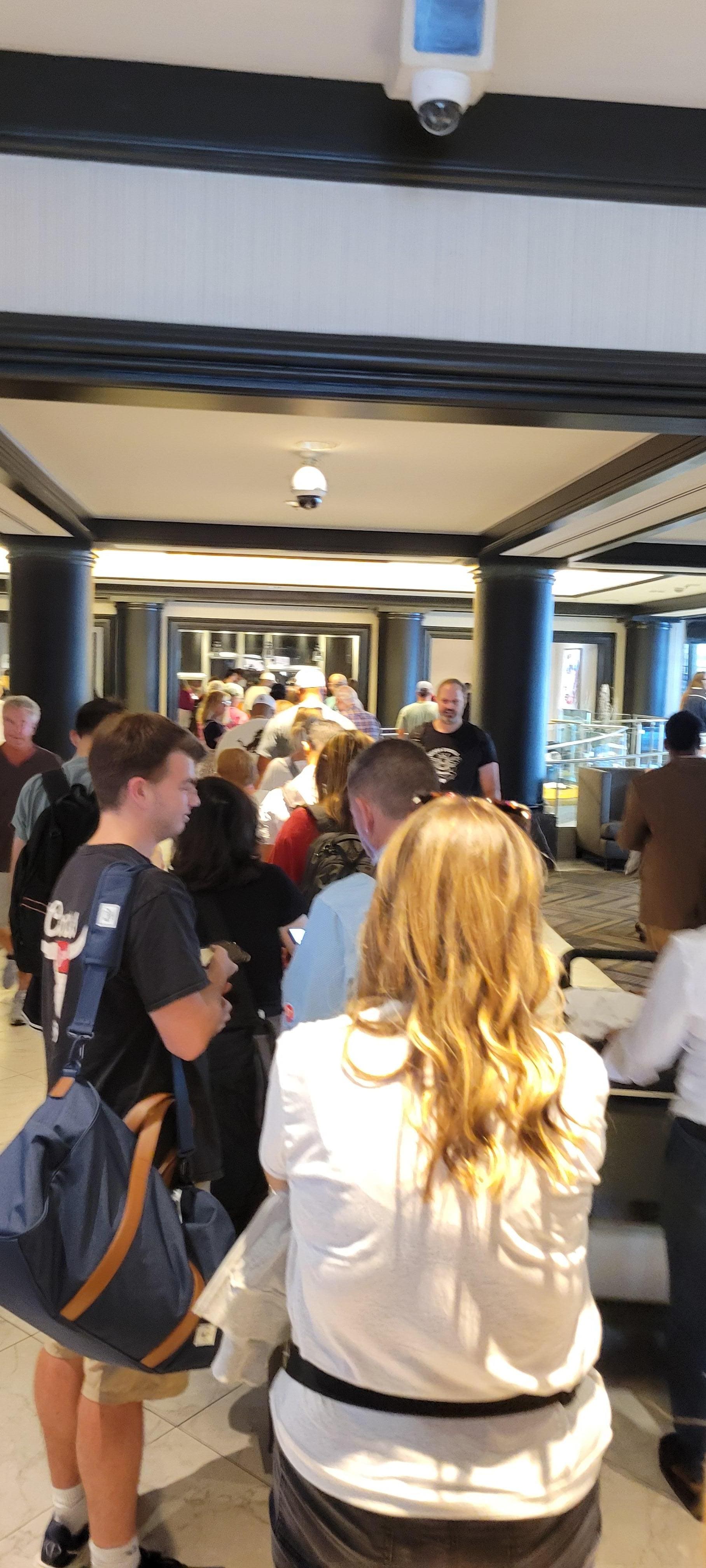 You can almost see check in desk at the front of the long line waiting to check in.