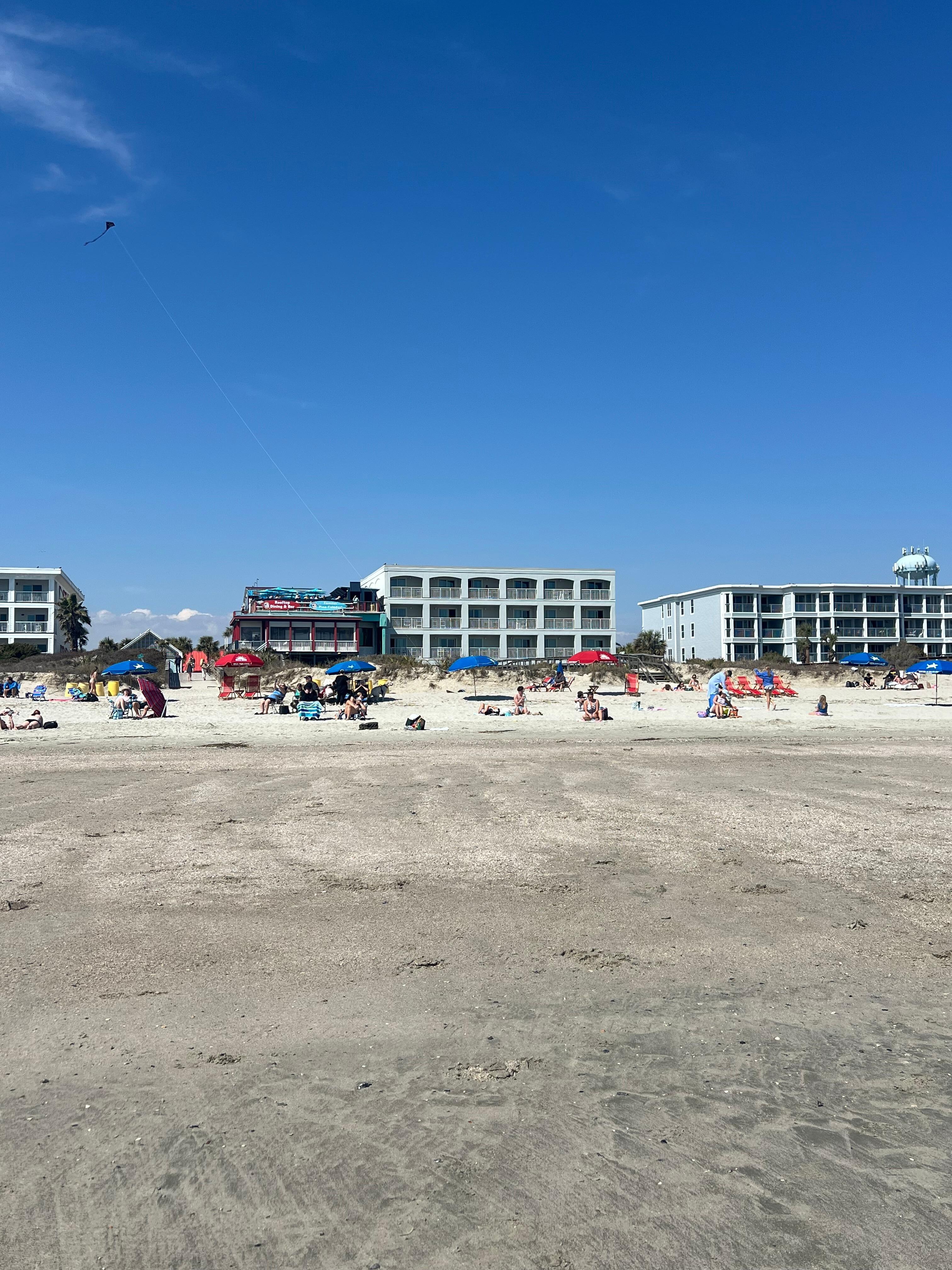 Standing on the beach facing the hotel 