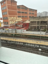 View from room, run down industrial area.