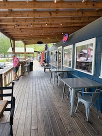 These are train cars with a cafe and a brewery.
