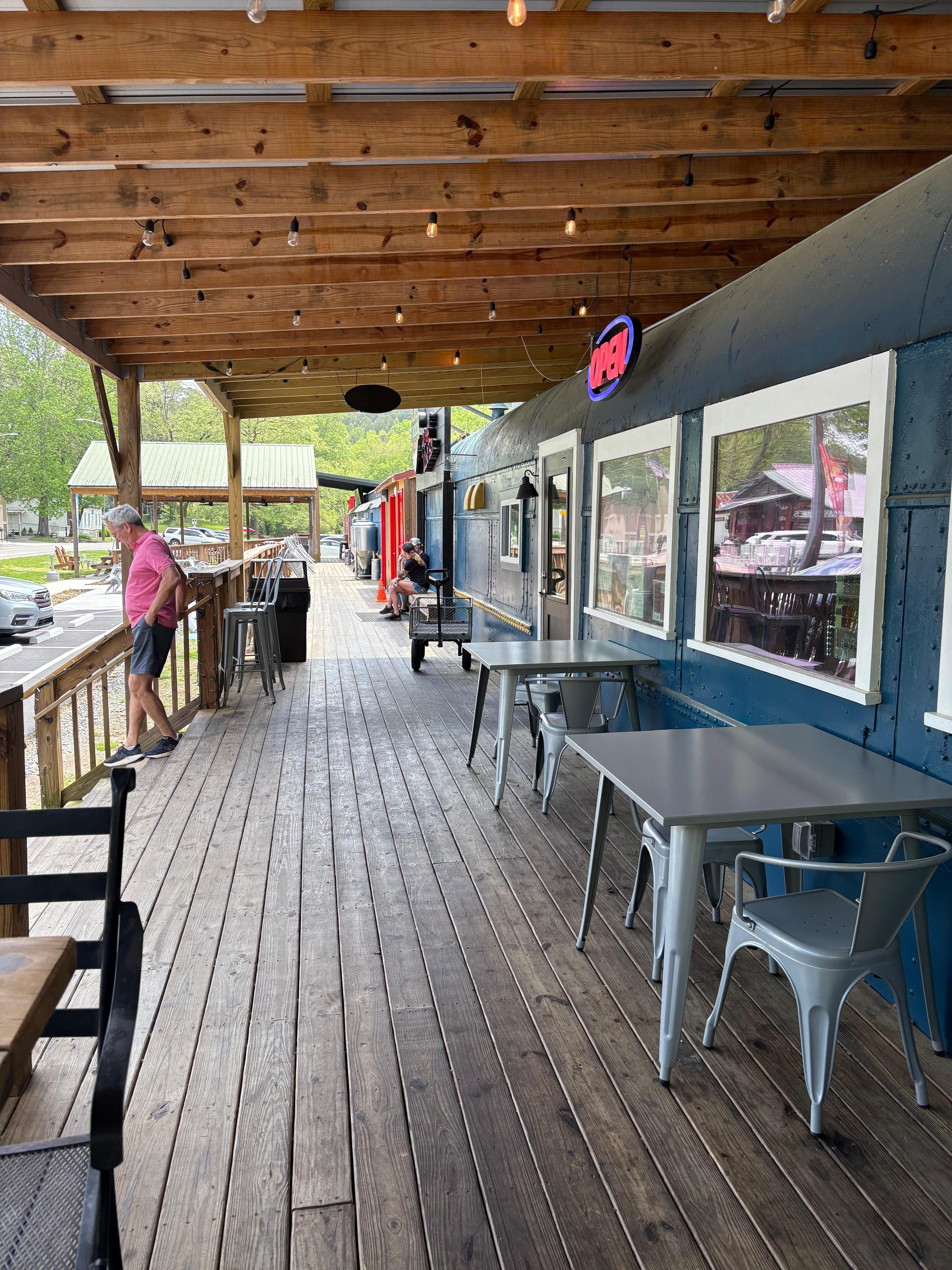 These are train cars with a cafe and a brewery.