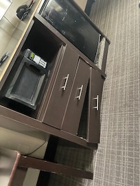 Broken dresser dirty filthy ness zoom in to the fridge area