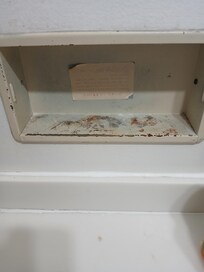 Worn bathroom tissue holder, no tissues