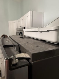 Filth on top of the fridge.