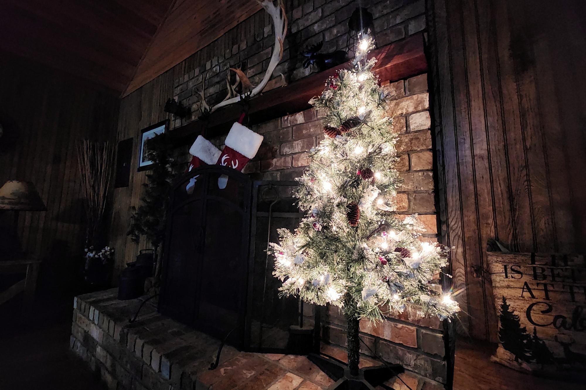 The fireplace decorated for Christmas.