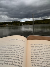 Sitting on the dock, reading just before the downpour.