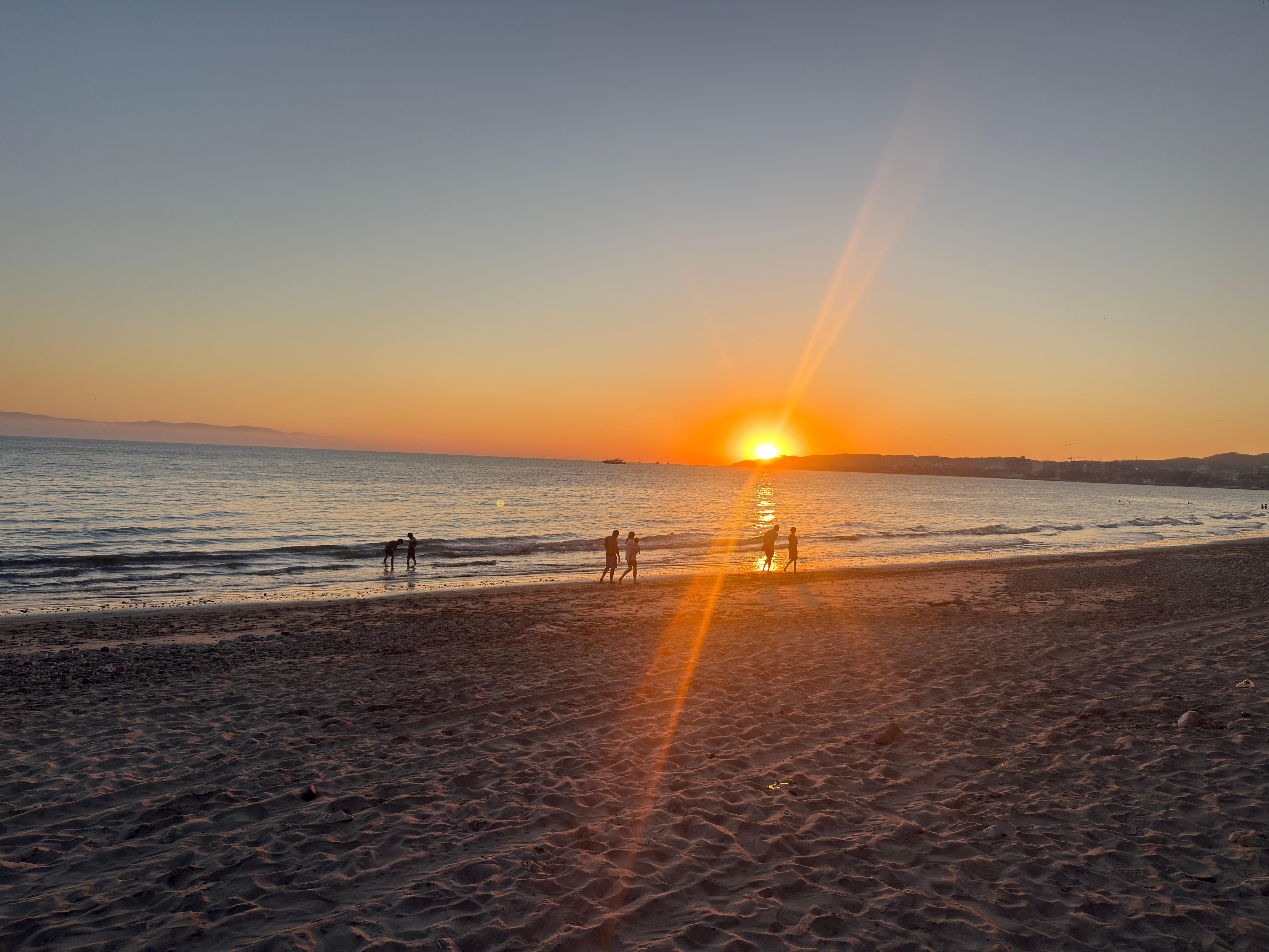 The sunset from the beach that is steps away from the rear of the hotel
