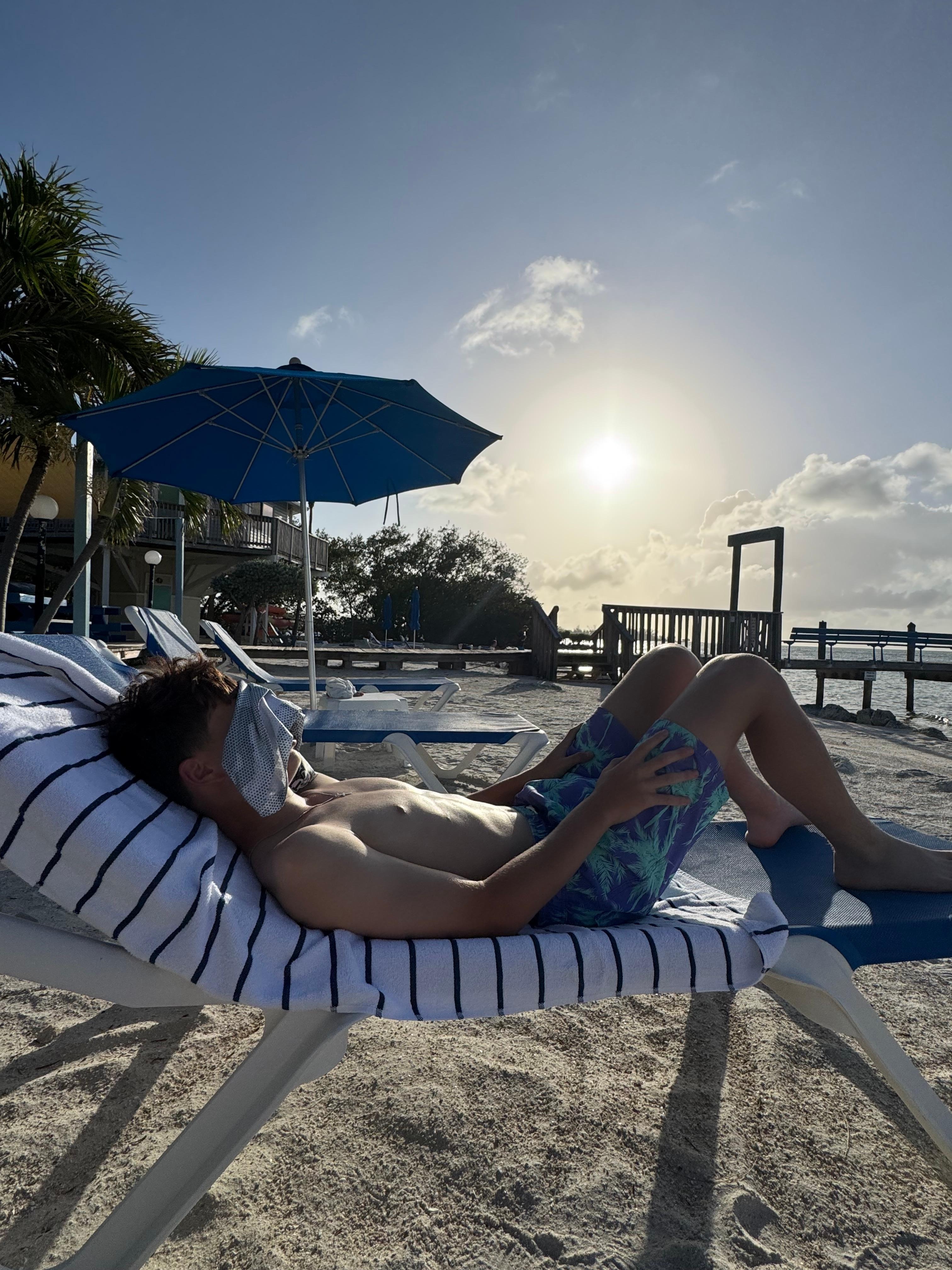 Relaxing on the beach in front of the property.