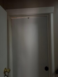 Door at bottom of stairs where smoke came through