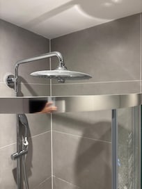Proximity of shower head to cubicle. And dust