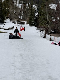 Sledding on the slope after the skiing closed - the kids were able to sled and we could all enjoy watching them from our home