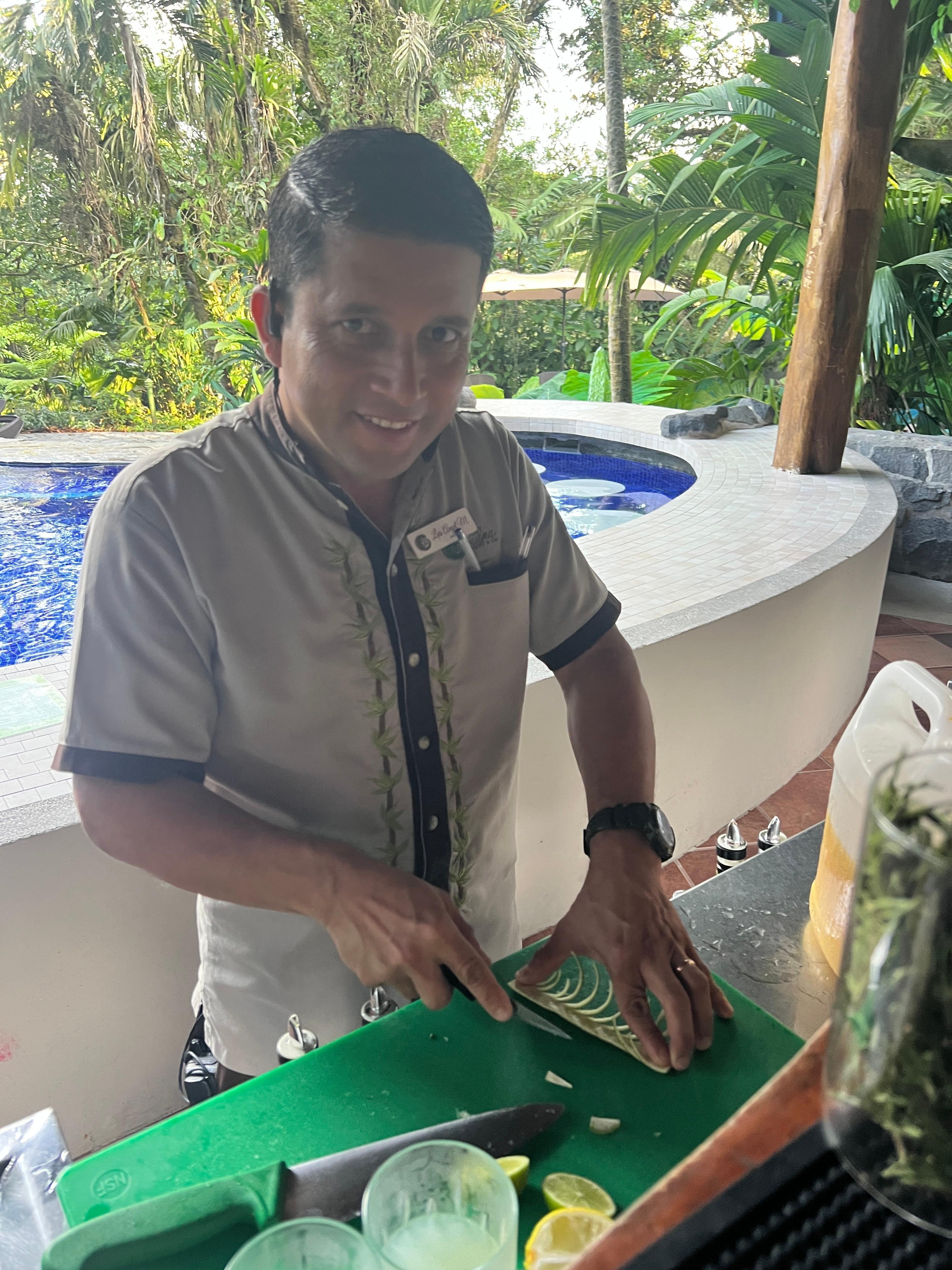 Luis working at the bar at happy hour 