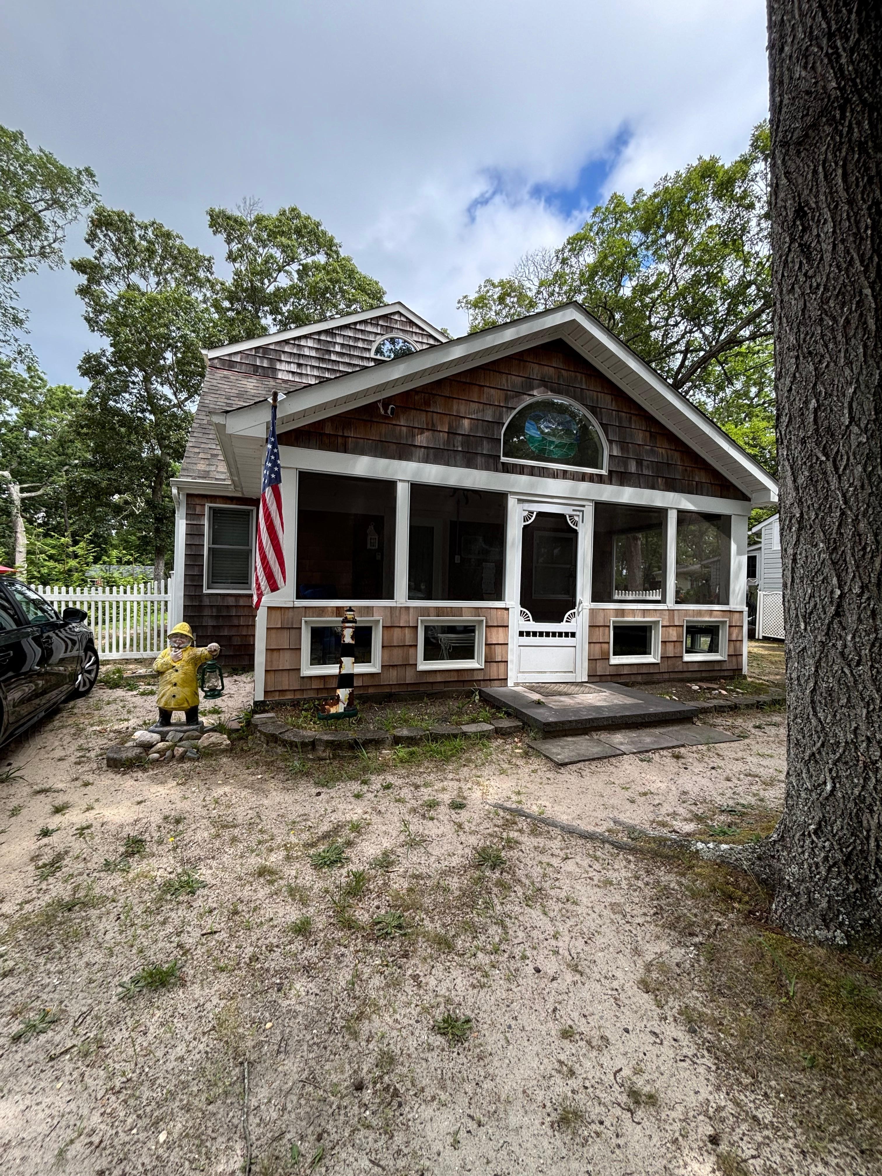 Front view, love at first sight. Inside front door is colorful front screened in porch. 