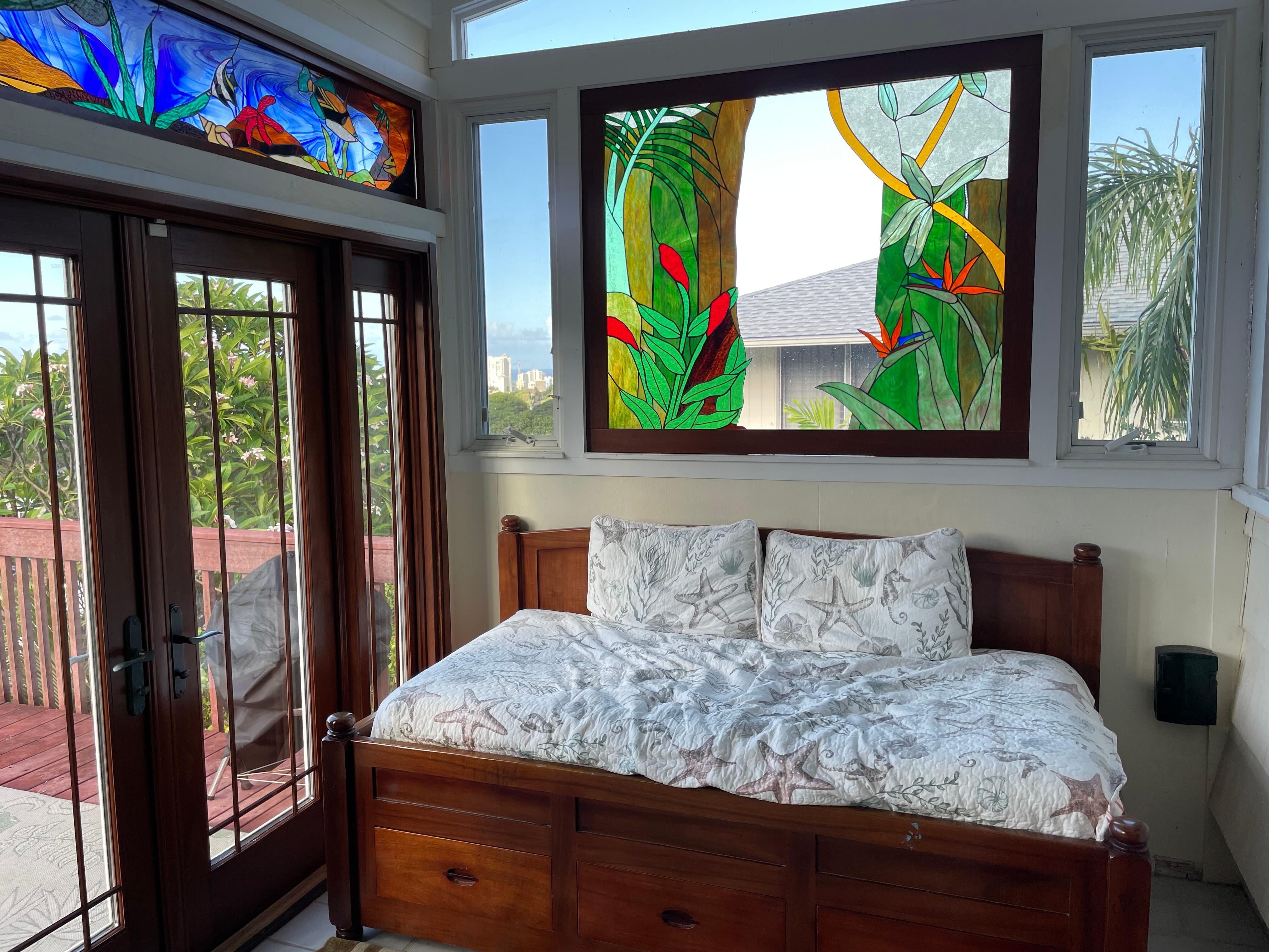 Daybed and stained glass in an alcove off of the living room.