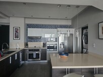 Open kitchen with full size appliances.