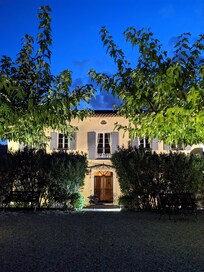 Entrance is well lit at night.