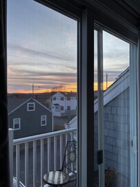 Sunset out of window to balcony