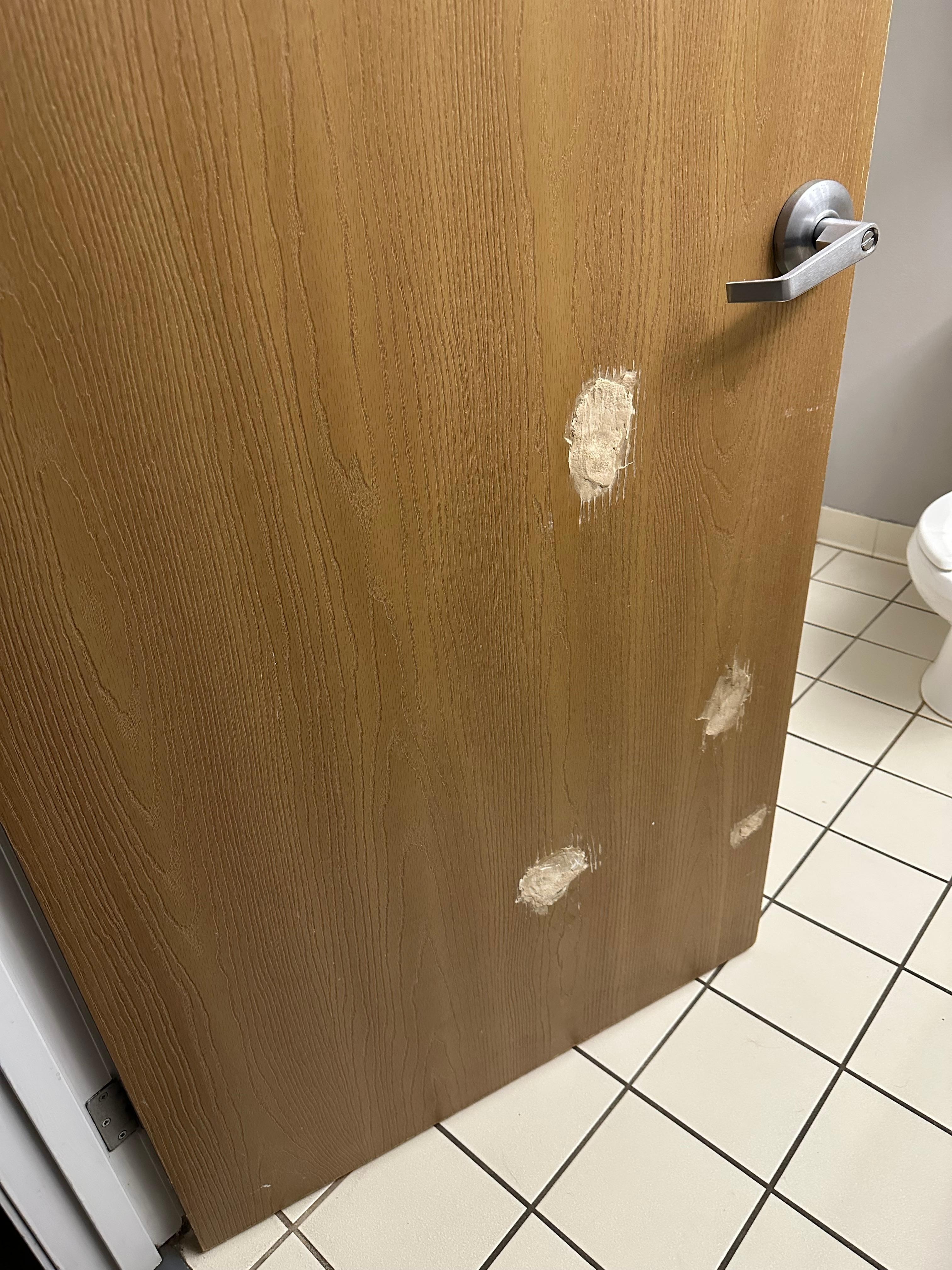 Patched door to bathroom. 