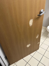 Patched door to bathroom.