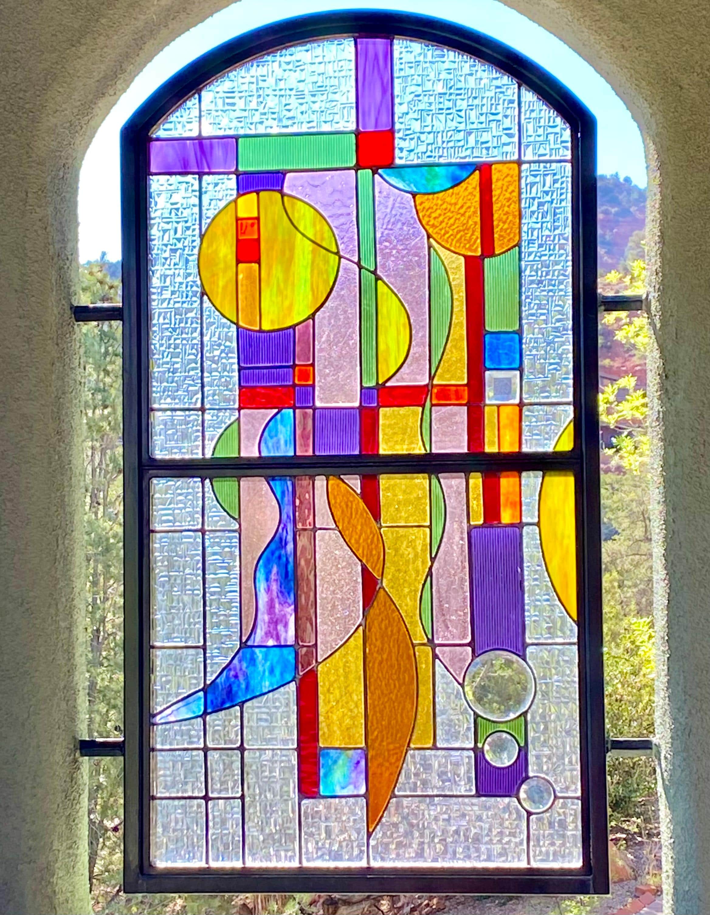 One of 3 stained glass pieces on balcony