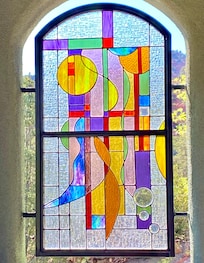 One of 3 stained glass pieces on balcony