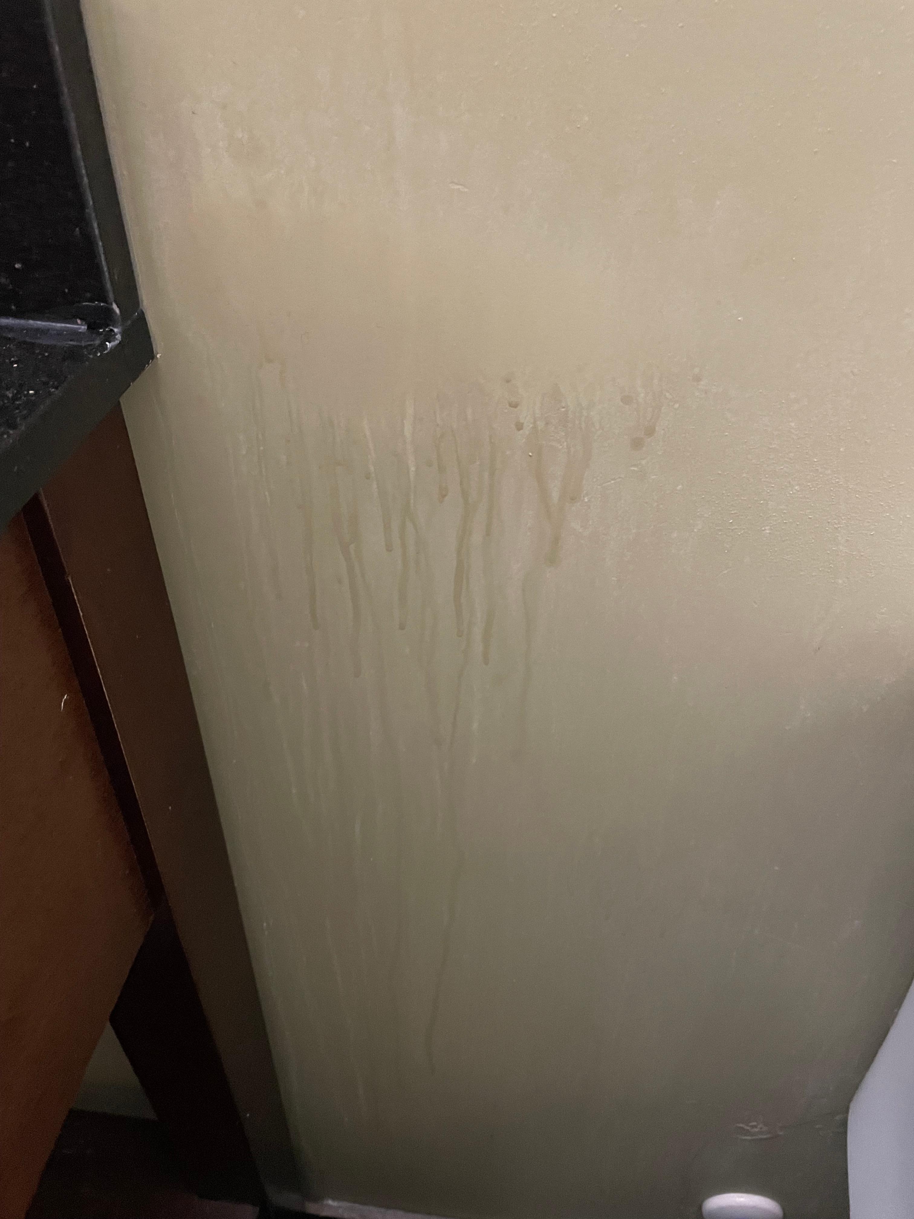 Residue on wall beside bed