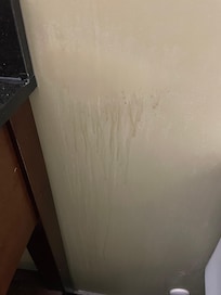 Residue on wall beside bed
