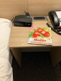 Book and dirty table between beds
