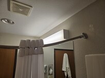 Shower curtain rod pulling out of the wall, so curtain would only cover the small area pictured.