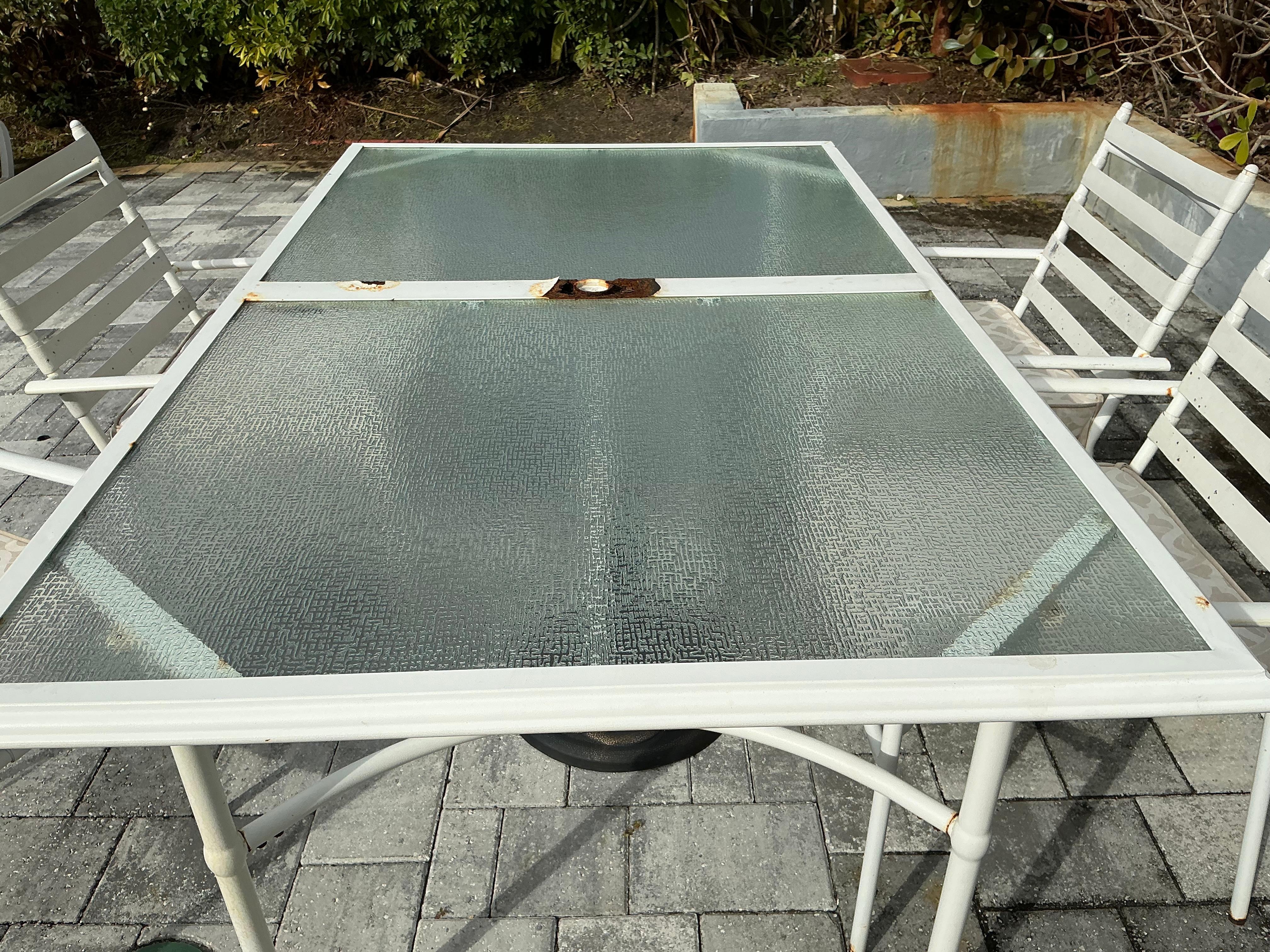 Rusted outdoor table with moldy chairs