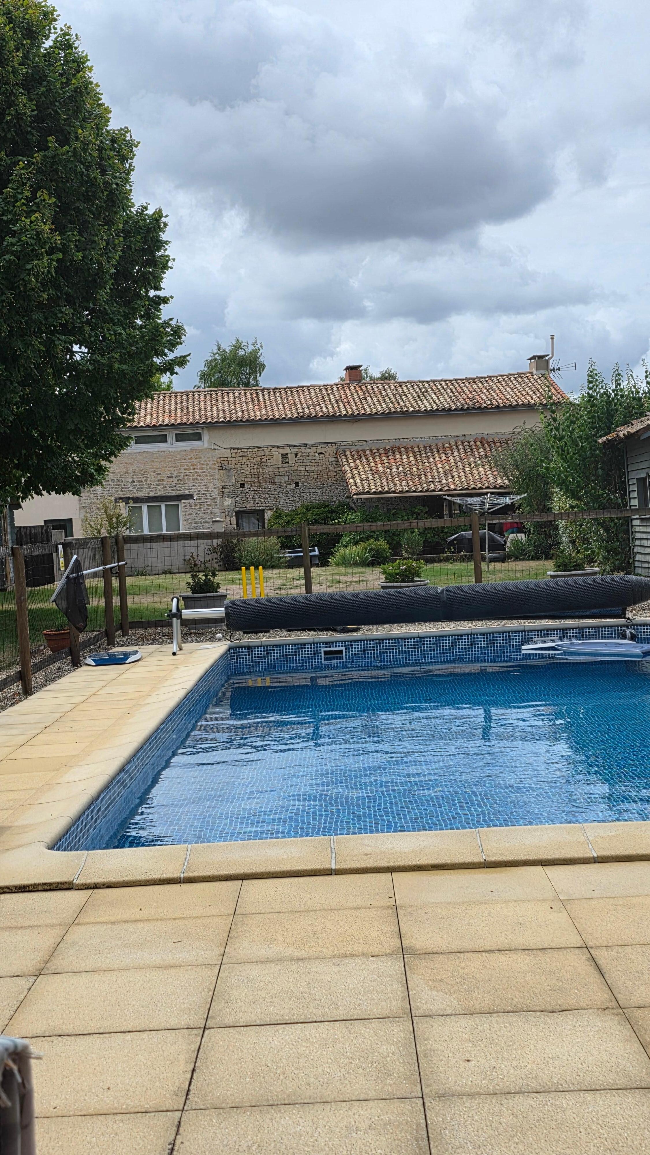 The beautiful pool and pool area including covered seating area