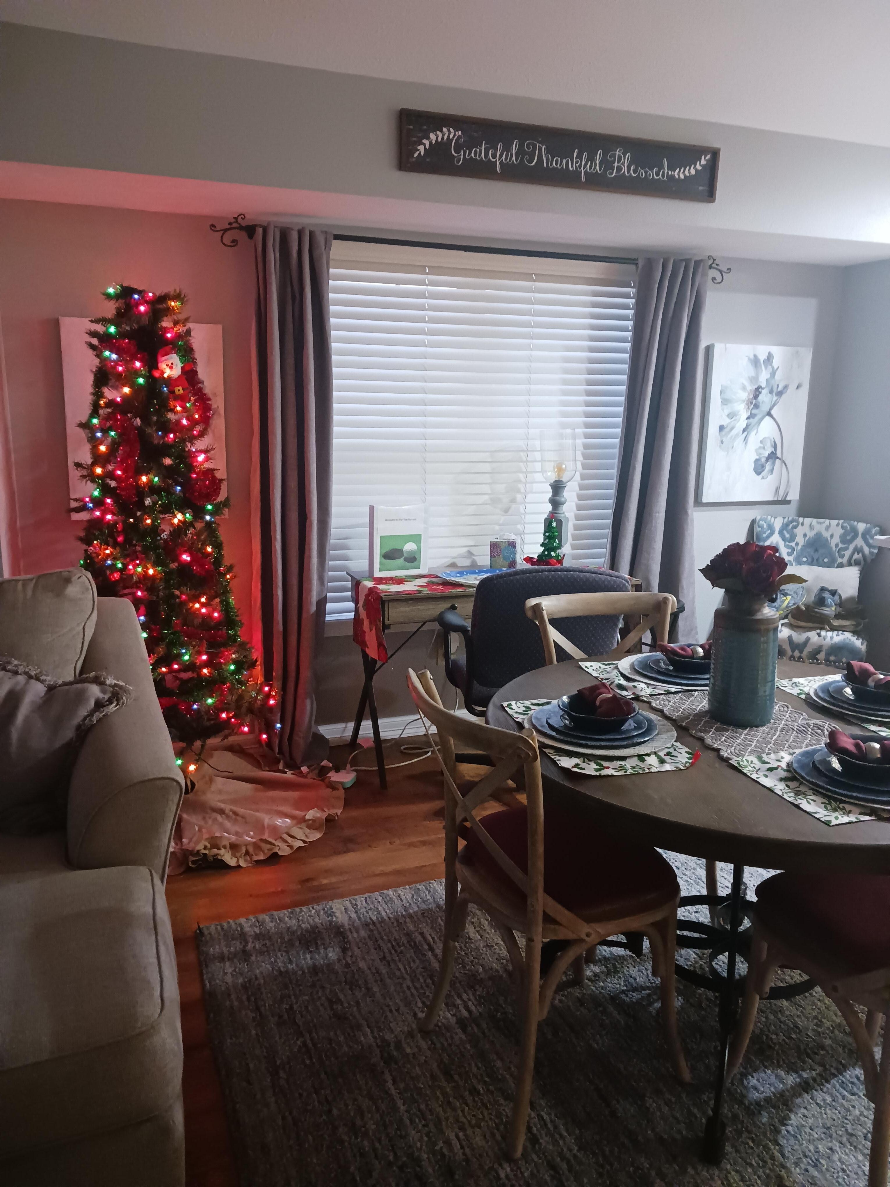 Dining area with desk and Christmas tree