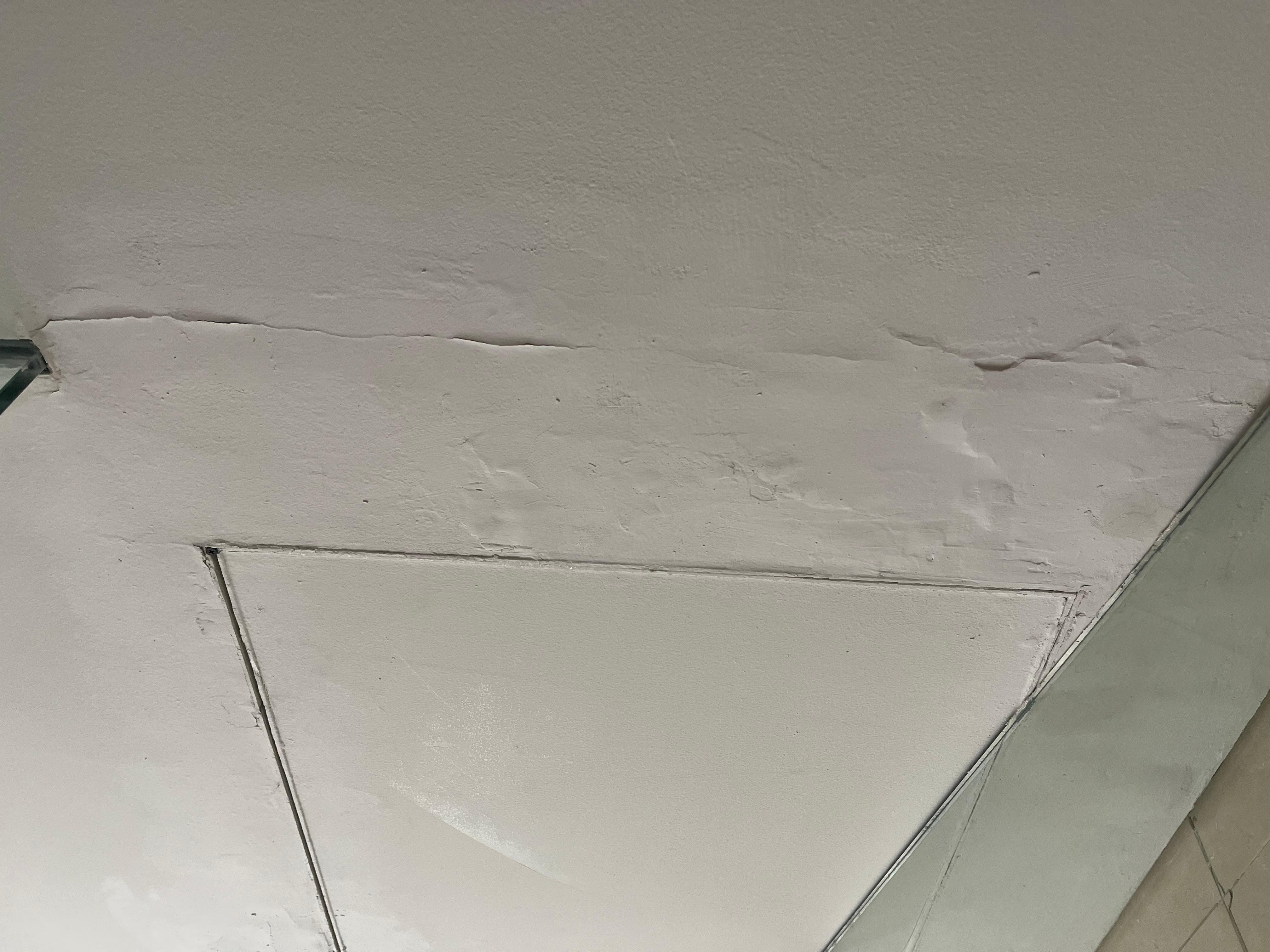 Previous leak in bathroom ceiling poorly repaired
