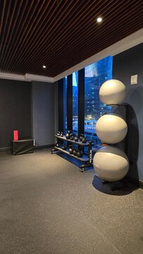 Gym with plenty of equipment for a variety of workout needs.