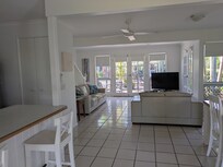 French doors to the pool & gardens...