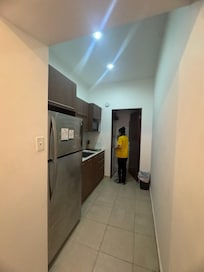 at the end of the hall from the entry, the kitchen