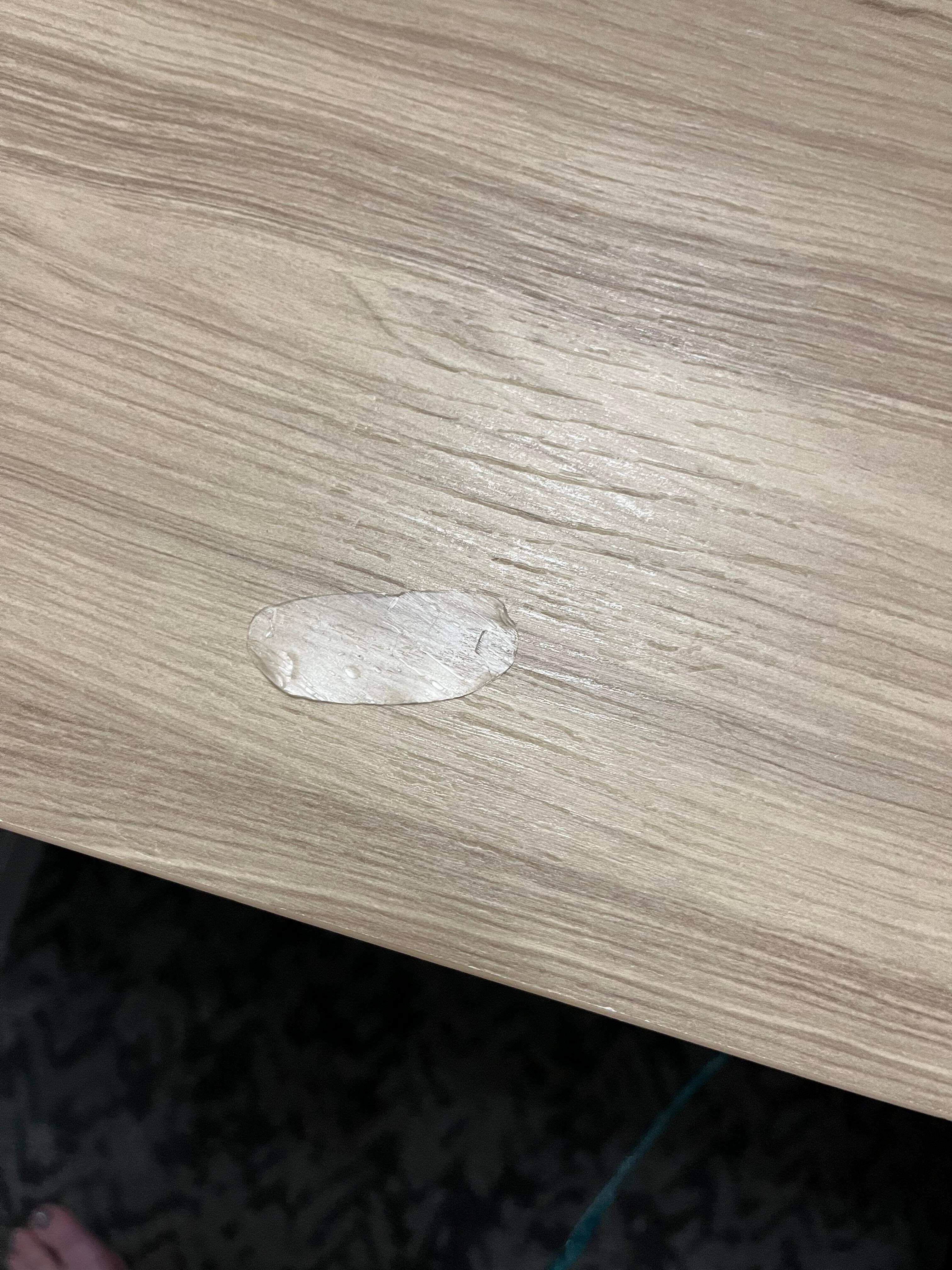 Under eye patch stuck on bedside table from previous guest. 