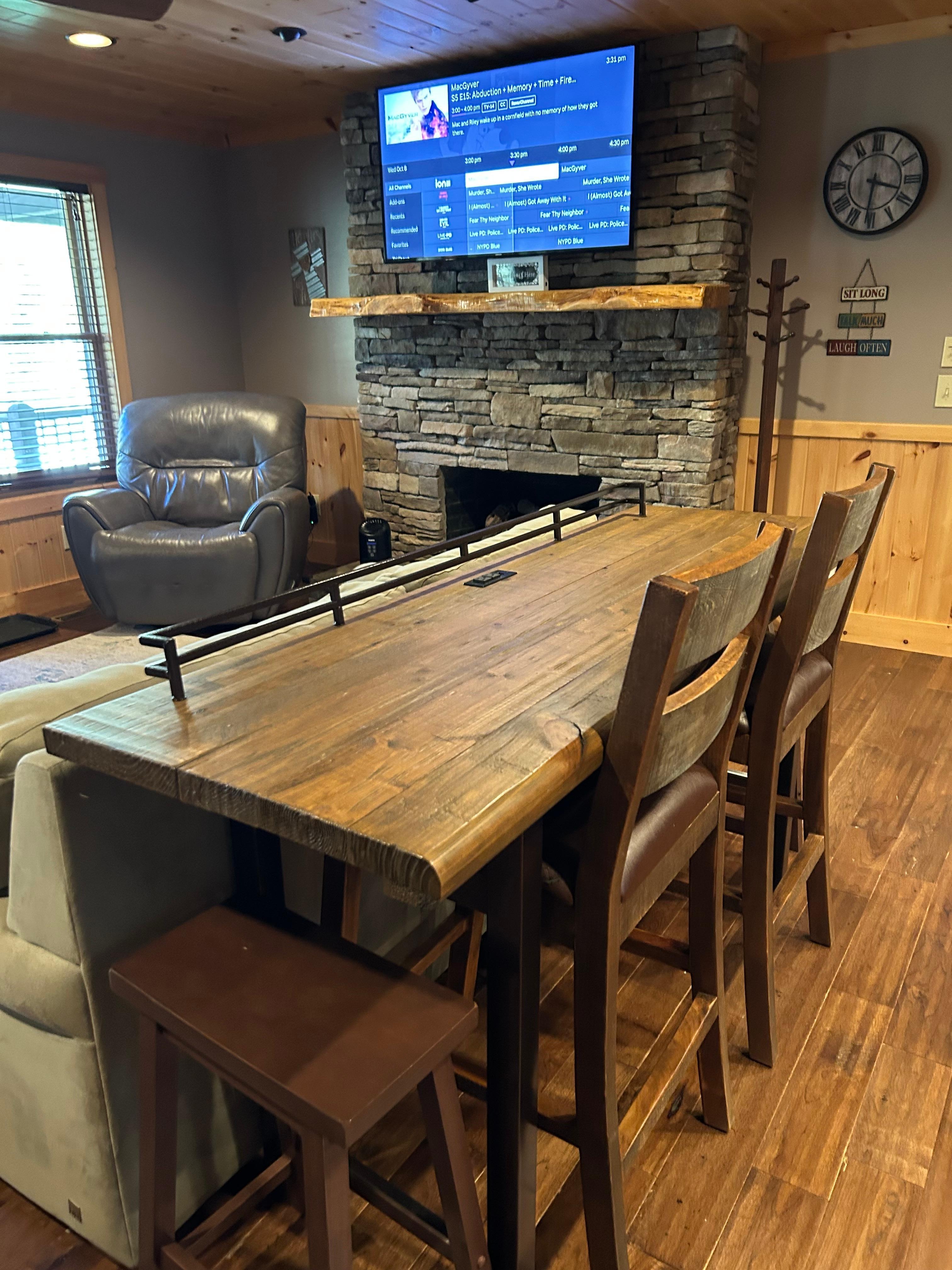 Casual dining overlooking fireplace and TV