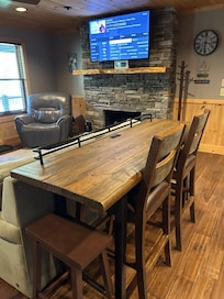 Casual dining overlooking fireplace and TV