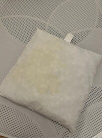 Stained pillow for sleeper sofa with no pillowcase provided