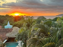 Sunset ocean view overlooking the pool from hotel room