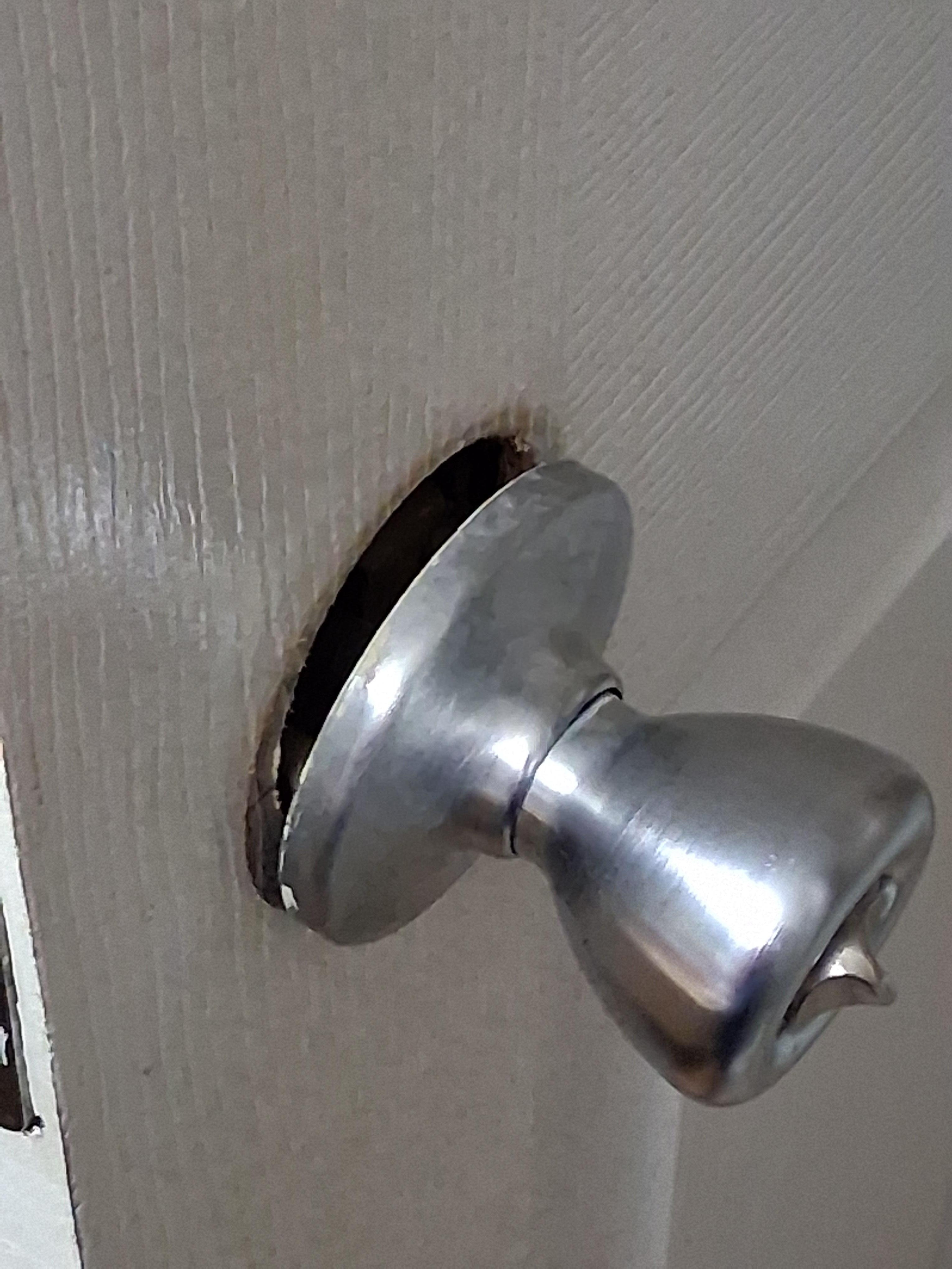 Bathroom door knob coming off .