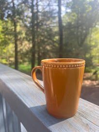 Morning cup of coffee in the stillness, on the front patio.