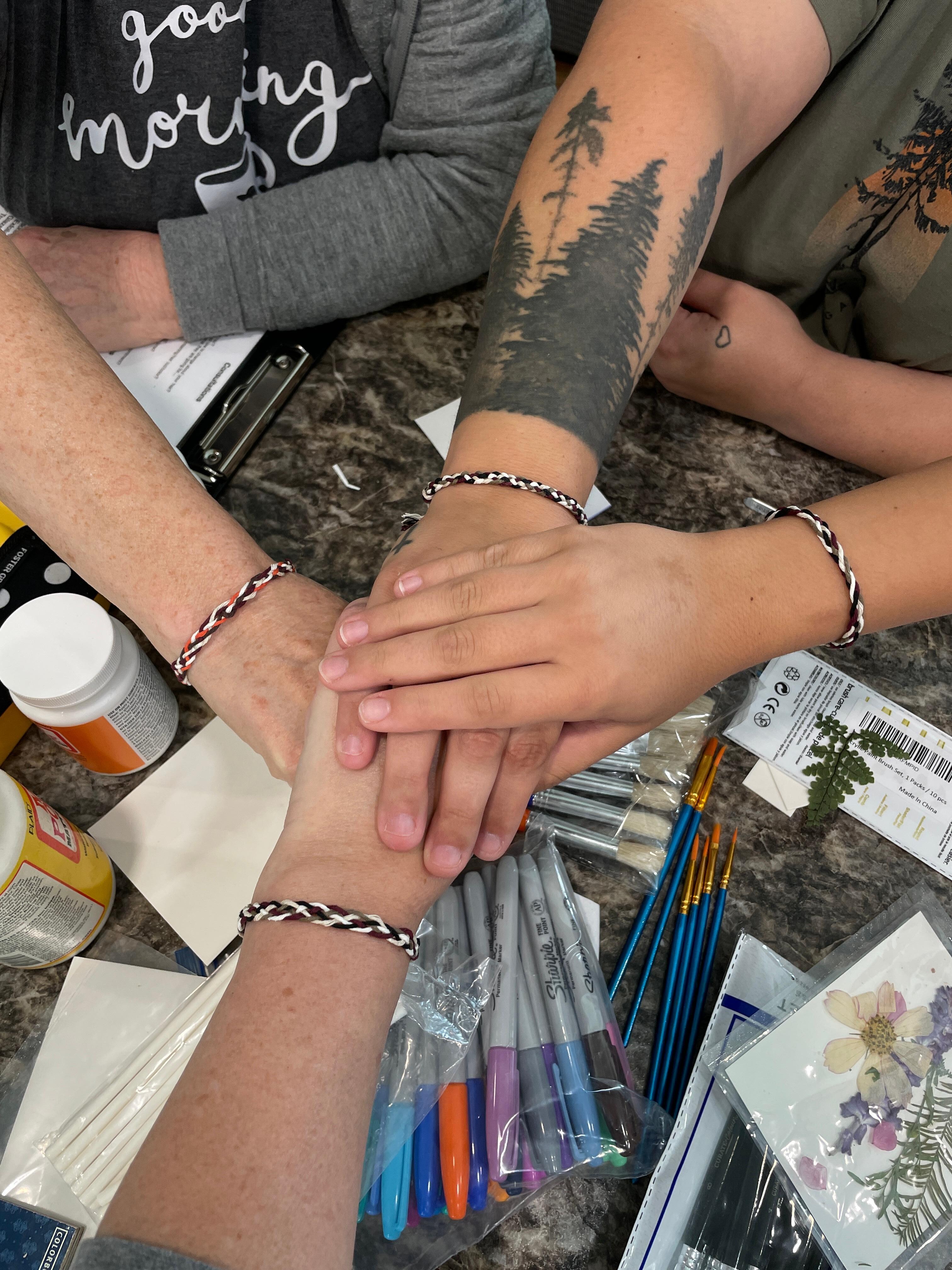 Just a pic of the friendship bracelets we made while there