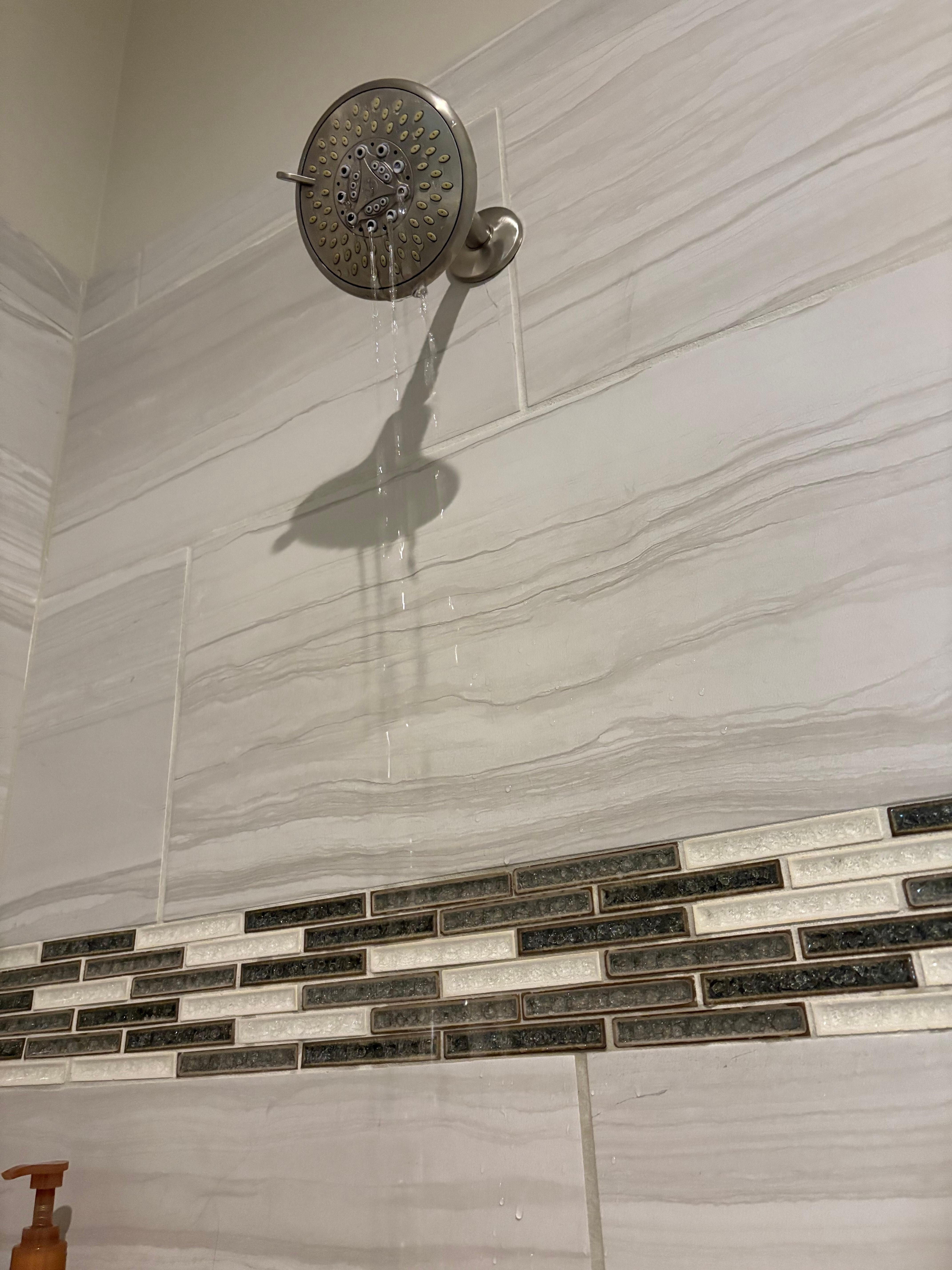 The water coming out of the shower in the good bathroom.  